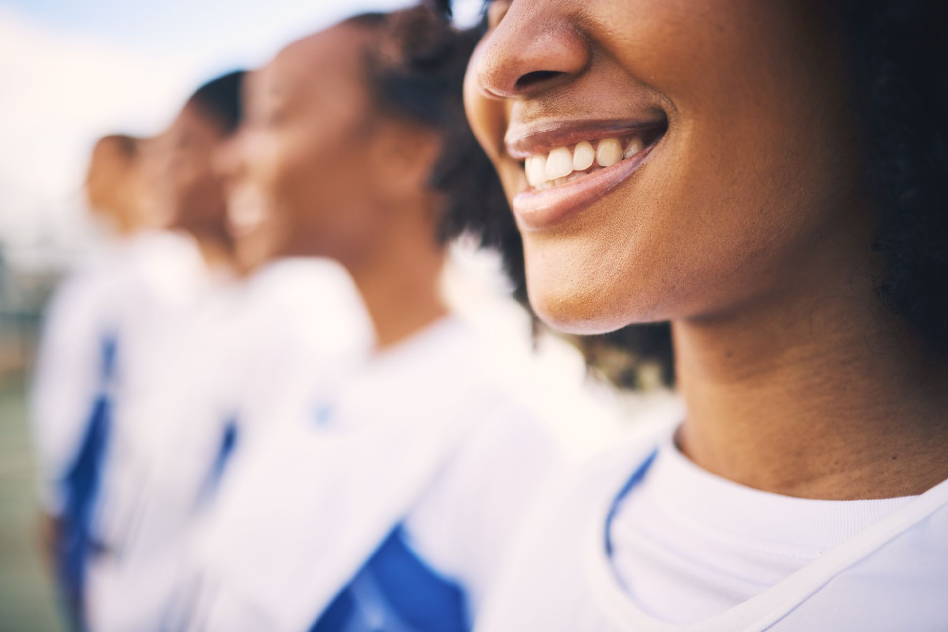 sports-netball-and-row-of-women-with-smile-ready-2025-04-06-07-32-06-utc (1)