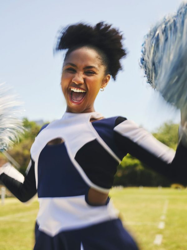 woman-cheerleader-and-smile-with-pompoms-on-field-2025-04-06-08-24-47-utc (1)